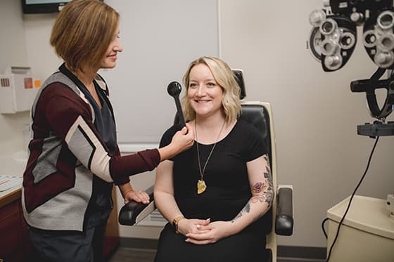 eye doctor with patient during lasik exam