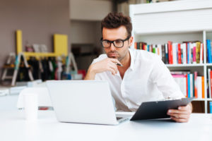 Man Sitting at a computer