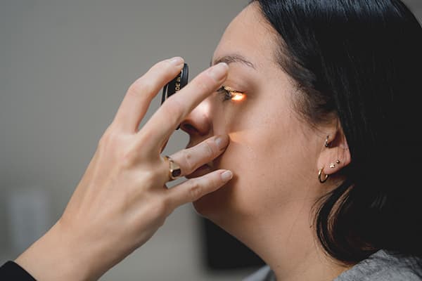 Woman having eye examined