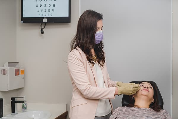 Eye doctor with patient