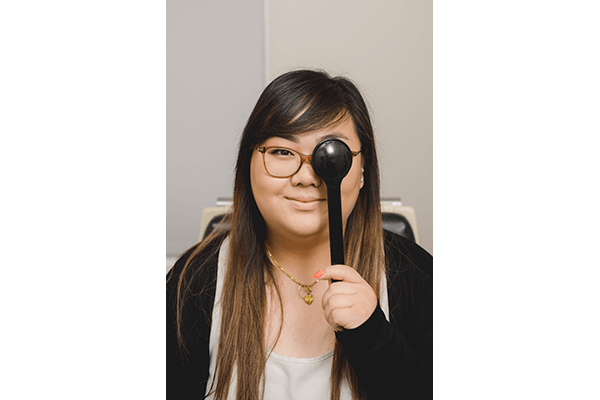 Woman with one eye covered during eye exam
