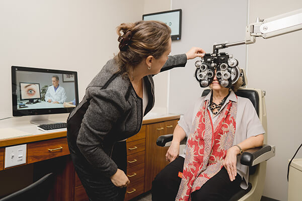 Woman getting eyes examined with phoraptor