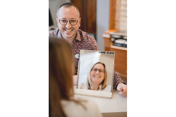 Woman trying on new eyeglasses